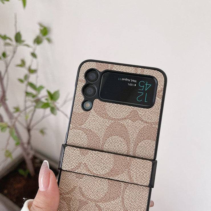 Looopix Coach Z Flip Samsung Phone Case with Finger Strap