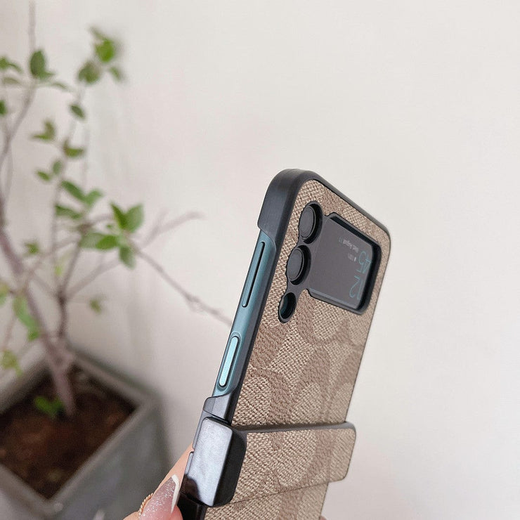 Looopix Coach Z Flip Samsung Phone Case with Finger Strap