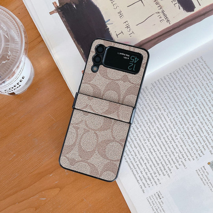 Looopix Coach Z Flip Samsung Phone Case with Finger Strap