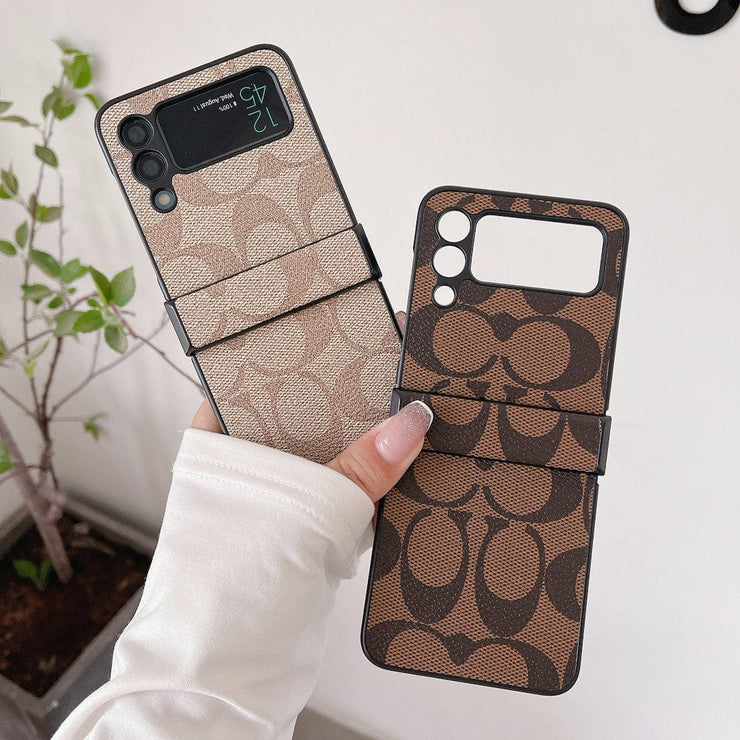 Looopix Coach Z Flip Samsung Phone Case with Finger Strap