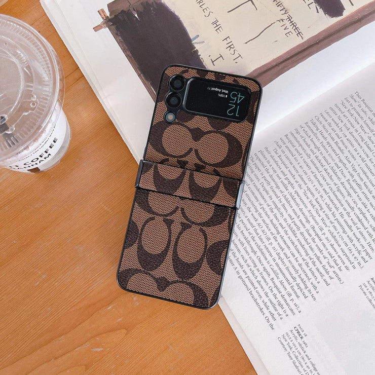 Looopix Coach Z Flip Samsung Phone Case with Finger Strap