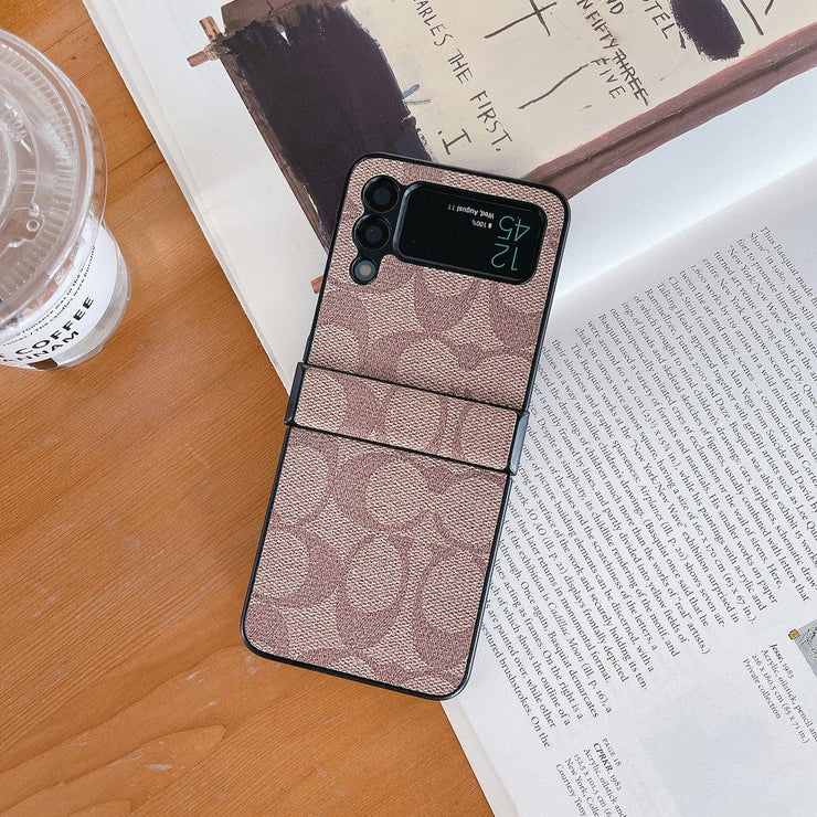 Looopix Coach Z Flip Samsung Phone Case with Finger Strap