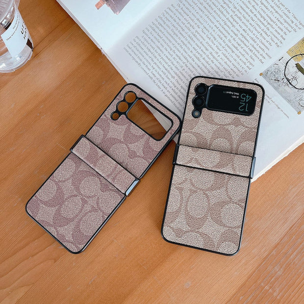 Looopix Coach Z Flip Samsung Phone Case with Finger Strap