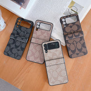 Looopix Coach Z Flip Samsung Phone Case with Finger Strap